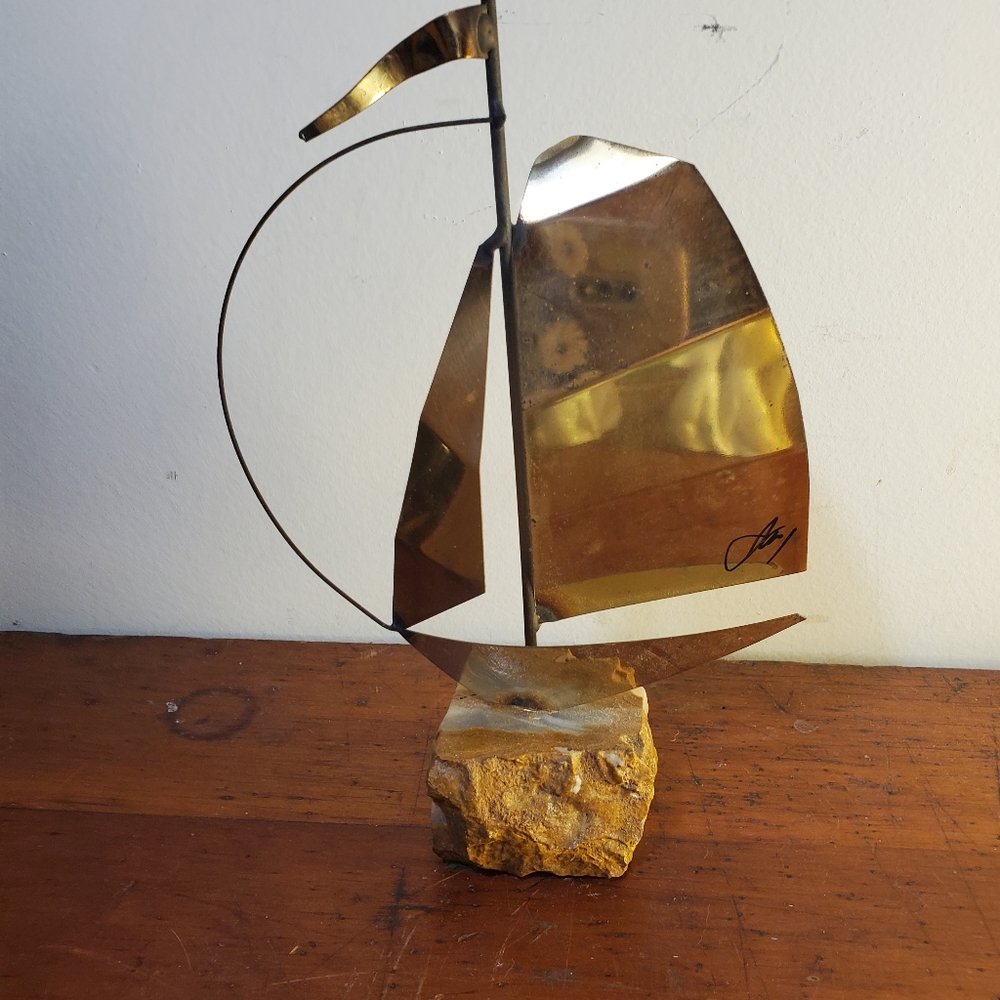 MID-CENTURY MODERN METAL SAIL BOAT ON QUARTZ  PEDESTAL, BY CURTIS JERE, SIGNED